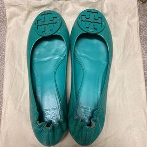 Tory Burch flats in a bright teal color